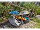 Storage area for community kayaks near the water and lush surroundings at 23465 Harborview Rd # 915, Punta Gorda, FL 33980