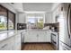 Bright, modern kitchen with stainless steel appliances and quartz countertops at 23465 Harborview Rd # 915, Punta Gorda, FL 33980