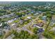 Aerial view of property in a waterfront community with canals, lush greenery, and roads throughout neighborhood at 2368 Pellam Blvd, Port Charlotte, FL 33948