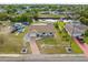 Aerial view showcasing the property's location, neighborhood, and access to the nearby canal at 2368 Pellam Blvd, Port Charlotte, FL 33948