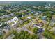 Aerial view of property in a waterfront community with canals, lush greenery, and proximity to local roads at 2368 Pellam Blvd, Port Charlotte, FL 33948