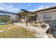 Backyard with a screened lanai, pool, and a covered patio perfect for relaxing and entertaining outdoors at 2368 Pellam Blvd, Port Charlotte, FL 33948