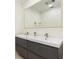 Bathroom featuring a double sink vanity with modern fixtures and plenty of storage at 2368 Pellam Blvd, Port Charlotte, FL 33948