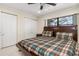 Bedroom with a wooden bed frame, a window view, and dual closets at 2368 Pellam Blvd, Port Charlotte, FL 33948