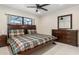 Comfortable bedroom with wooden furniture and a window view to the outside at 2368 Pellam Blvd, Port Charlotte, FL 33948
