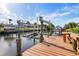 The dock is equipped with boat lifts for easy access to the water and enjoyment of waterfront living at 2368 Pellam Blvd, Port Charlotte, FL 33948
