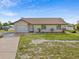 Charming single-story home with a well-manicured lawn and attached one-car garage at 2368 Pellam Blvd, Port Charlotte, FL 33948