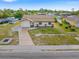 Attractive single-Gathering home with a tidy front yard, attached garage, and a welcoming driveway at 2368 Pellam Blvd, Port Charlotte, FL 33948