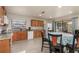 Efficient kitchen and dining area featuring ample cabinetry, granite countertops, and modern appliances at 2368 Pellam Blvd, Port Charlotte, FL 33948