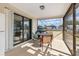Enclosed lanai showcasing a table and chairs, offering an enjoyable outdoor space at 2368 Pellam Blvd, Port Charlotte, FL 33948