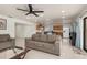 Open-concept living room showcasing sleek tile flooring and an adjacent kitchen and dining area at 2368 Pellam Blvd, Port Charlotte, FL 33948