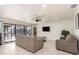 Inviting living room with modern lighting, neutral walls, and a sliding glass door offering outdoor view at 2368 Pellam Blvd, Port Charlotte, FL 33948