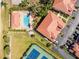 An aerial view of the community pool and tennis court at 240 West End Dr # 622, Punta Gorda, FL 33950