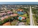 Sprawling aerial view showcases a community with a pool, tennis courts, and waterfront access at 240 West End Dr # 622, Punta Gorda, FL 33950