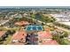 Aerial view highlighting the location of the community with nearby tennis courts, pool, lake and commercial areas at 240 West End Dr # 622, Punta Gorda, FL 33950