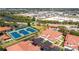 Aerial shot of the community showing townhomes, parking, tennis courts, and a swimming pool area at 240 West End Dr # 622, Punta Gorda, FL 33950