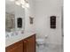 Well lit bathroom featuring a marble countertop, vanity with cabinets, and tiled shower at 240 West End Dr # 622, Punta Gorda, FL 33950