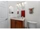 Bathroom featuring wood vanity with sink, marble countertop, and tiled shower at 240 West End Dr # 622, Punta Gorda, FL 33950