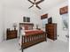 Cozy bedroom with a ceiling fan, comfortable bedding, and a TV for relaxation at 240 West End Dr # 622, Punta Gorda, FL 33950