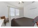 Comfortable bedroom featuring a ceiling fan, two windows, and closet at 240 West End Dr # 622, Punta Gorda, FL 33950