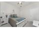 Cozy bedroom featuring a ceiling fan, closet, and comfortable bed at 240 West End Dr # 622, Punta Gorda, FL 33950