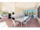 A community room with tables, chairs, and a TV at 240 West End Dr # 622, Punta Gorda, FL 33950