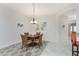 Cozy dining area with a round table, stylish chairs, and modern artwork at 240 West End Dr # 622, Punta Gorda, FL 33950