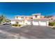 Townhomes with light exteriors, red tile roofs, and multiple garages at 240 West End Dr # 622, Punta Gorda, FL 33950