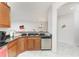 Kitchen featuring stainless steel appliances, granite countertops and wood cabinets at 240 West End Dr # 622, Punta Gorda, FL 33950