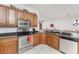 Kitchen featuring stainless steel appliances, granite countertops and wood cabinets at 240 West End Dr # 622, Punta Gorda, FL 33950