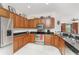 Kitchen with stainless steel appliances, granite countertops, and wood cabinets at 240 West End Dr # 622, Punta Gorda, FL 33950
