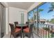 Screened lanai with comfortable seating and a view of the pool and lush landscaping at 240 West End Dr # 622, Punta Gorda, FL 33950