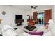 Comfortable living room with stylish decor, ample seating, and sliding glass doors to the balcony at 240 West End Dr # 622, Punta Gorda, FL 33950
