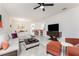 Comfortable living room with plush seating, modern decor, and a ceiling fan for added comfort at 240 West End Dr # 622, Punta Gorda, FL 33950