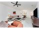 A spacious living room featuring tile floors, a comfortable sofa, and ample natural light at 240 West End Dr # 622, Punta Gorda, FL 33950