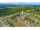 This aerial view captures the peaceful neighborhood of tree lined streets, a quiet preserve and community at 25313 Durango Ct, Punta Gorda, FL 33955