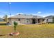 Well-maintained backyard with mature trees and privacy, enhancing the property's outdoor appeal at 25313 Durango Ct, Punta Gorda, FL 33955