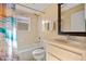 Well-maintained bathroom with shower-tub combo, vanity with sink, and a mirror at 25313 Durango Ct, Punta Gorda, FL 33955