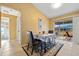 Cozy dining area with tile flooring and sliding glass doors leading to the backyard, creating an indoor-outdoor flow at 25313 Durango Ct, Punta Gorda, FL 33955
