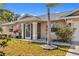 Inviting home exterior with well-lit pathway and beautiful landscaping, creating a warm and welcoming entrance at 25313 Durango Ct, Punta Gorda, FL 33955