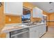 Bright kitchen featuring white cabinetry, modern appliances, and plenty of counter space, perfect for culinary enthusiasts at 25313 Durango Ct, Punta Gorda, FL 33955