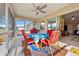 Cozy screened lanai features ceiling fan, grill and comfortable seating with views of the yard at 25313 Durango Ct, Punta Gorda, FL 33955