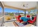 Screened lanai with ceiling fan and furniture offers expansive views of the backyard at 25313 Durango Ct, Punta Gorda, FL 33955