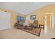 Comfortable living room with neutral tones, tile flooring, and a bright window, creating a cozy atmosphere at 25313 Durango Ct, Punta Gorda, FL 33955