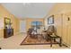 Bright living room showcasing tile floors, a large window, and a cozy seating area, ideal for relaxation at 25313 Durango Ct, Punta Gorda, FL 33955