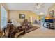 Spacious living room featuring tile flooring, vaulted ceilings, and sliding glass doors for ample natural light at 25313 Durango Ct, Punta Gorda, FL 33955