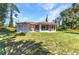 Beautiful backyard with a screened-in porch, offering a serene outdoor retreat for relaxation and enjoyment at 2679 Pascal Ave, North Port, FL 34286