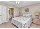 Inviting bedroom featuring tile flooring, neutral walls, and access to an ensuite bathroom for added privacy at 2679 Pascal Ave, North Port, FL 34286