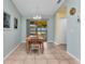 Dining area with tile floors, and a sliding glass door leading to the lanai at 2679 Pascal Ave, North Port, FL 34286