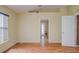 This room boasts wood floors and a window, offering a simple and adaptable space at 2699 Suncoast Lakes Blvd, Punta Gorda, FL 33980